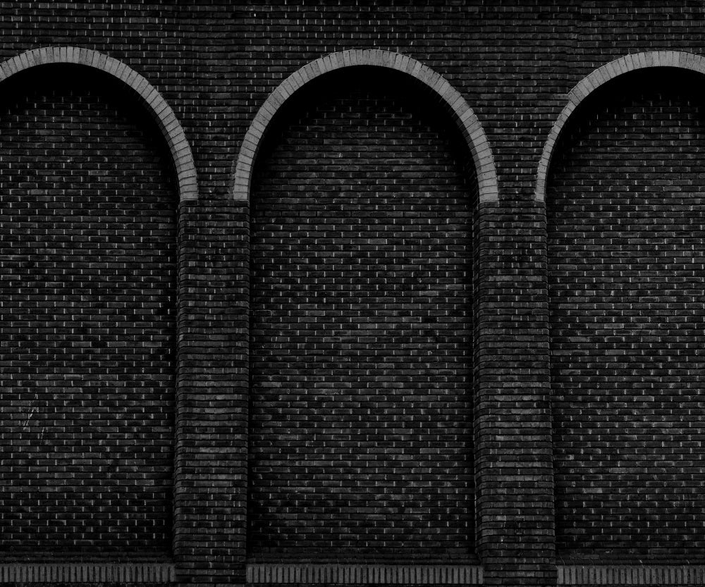 Fox Dark Gray Brick Factory Wall with Three Round Sealed Windows Vinyl Backdrop